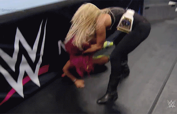 Charlotte-throws-Sasha-over-the-commentators-table