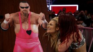 Ruby Riott antagonizes Natalya in front of a table of her father Jim Neidhart at WWE TLC