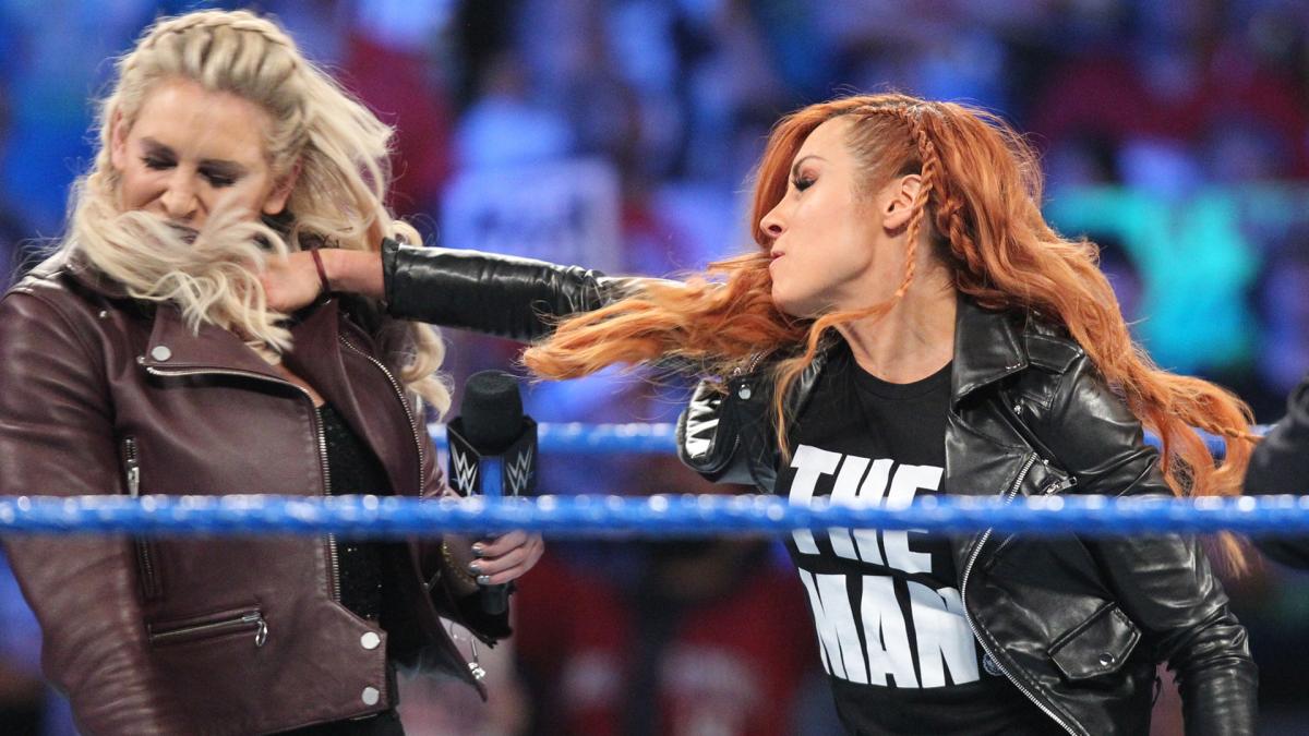 Becky Lynch punches Charlotte Flair