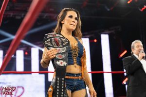 Mickie James as IMPACT! Wrestling Knockouts Champion